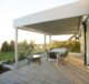 black metal table and chairs on green grass field during daytime